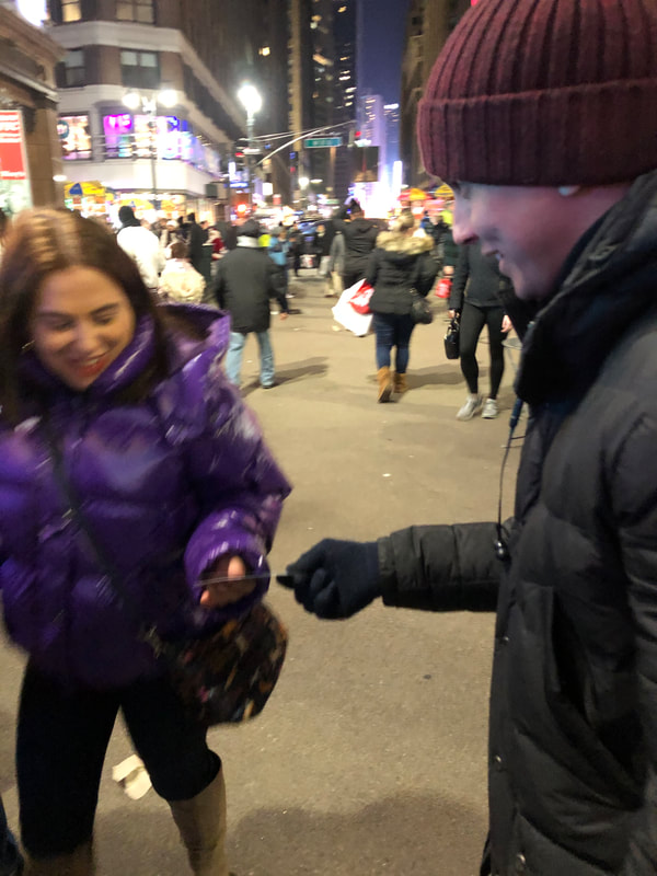 Tapuz, Inc. Brand Ambassador passing out samples in New York City