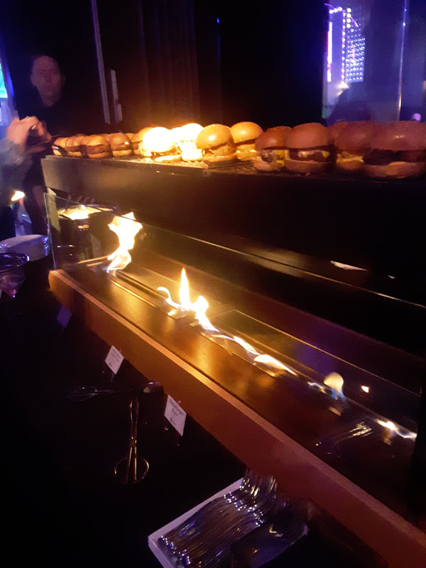 Flaming catering display at Manhattan venue.