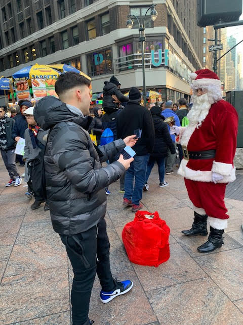 Tapuz New York City Brand Ambassador Staff with Santa Claus in Midtown Manhattan