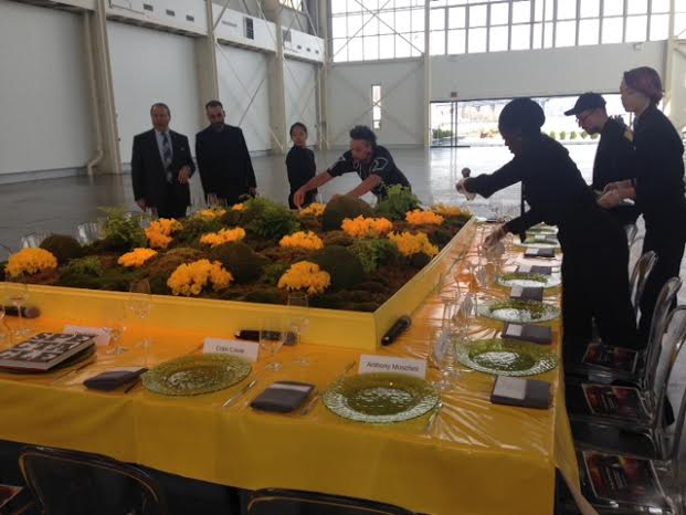 tapuz event staff setting up a table at a brooklyn nyc event