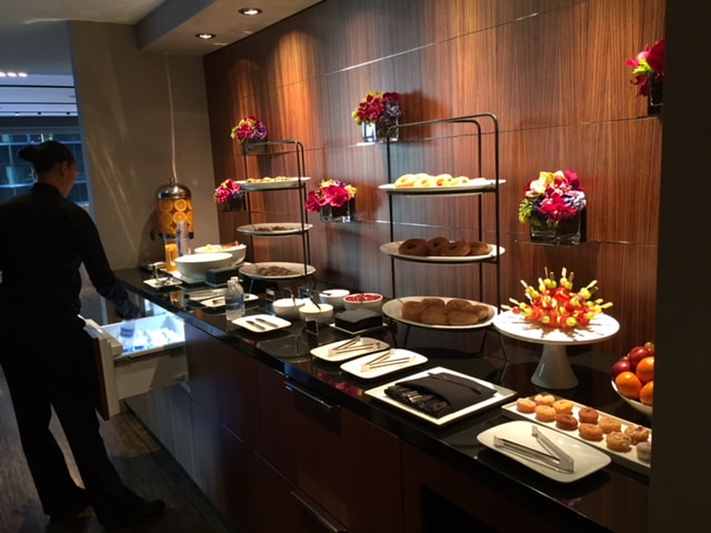 tapuz, inc. server setting up a buffet table at a manhattan corporate event
