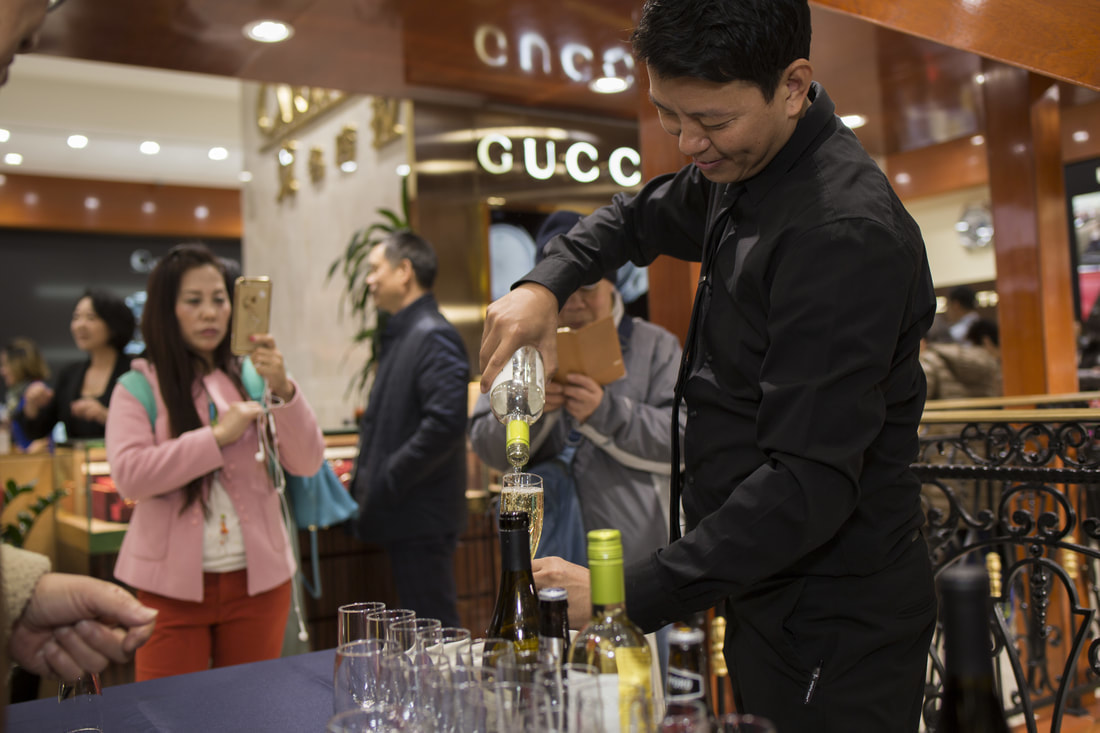 Bartender preparing drinks at catered NYC event.