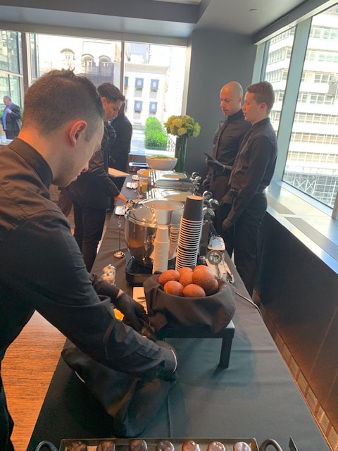 service staff by tapuz, inc. setting up a catered buffet station at new york city corporate event 