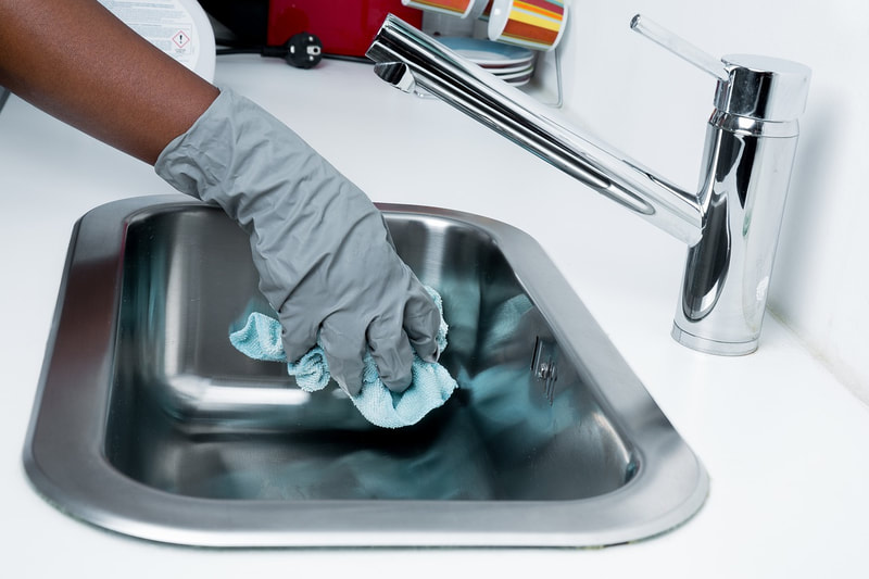Tapuz Staff Cleaning Sink