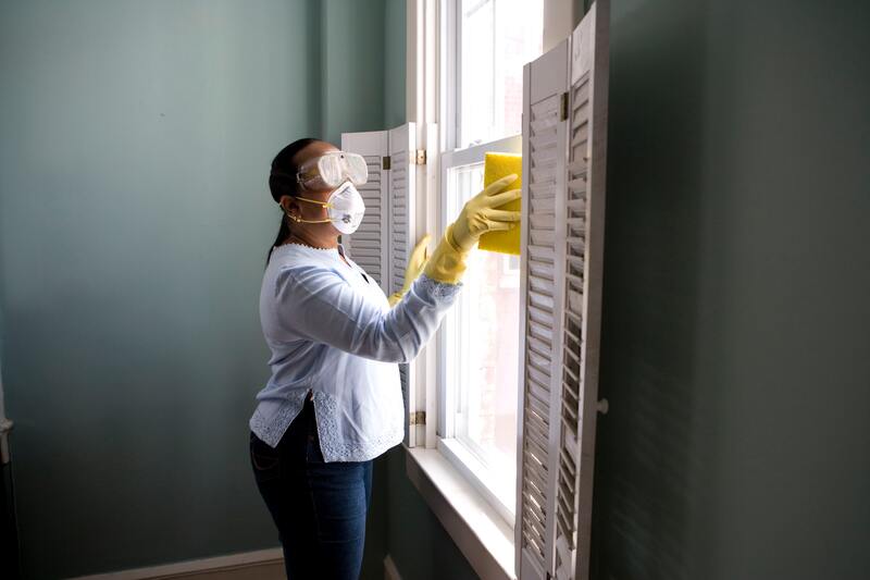 Cleaning window from inside of house
