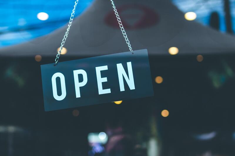 open for business sign in retail window